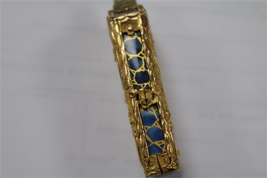 An early 20th century continental gold overlaid enamelled glass scent bottle, 75mm.